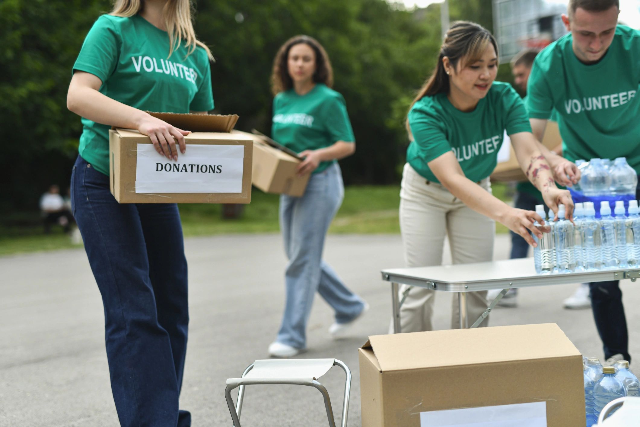Volunteers organizing materials for a ministry outreach event